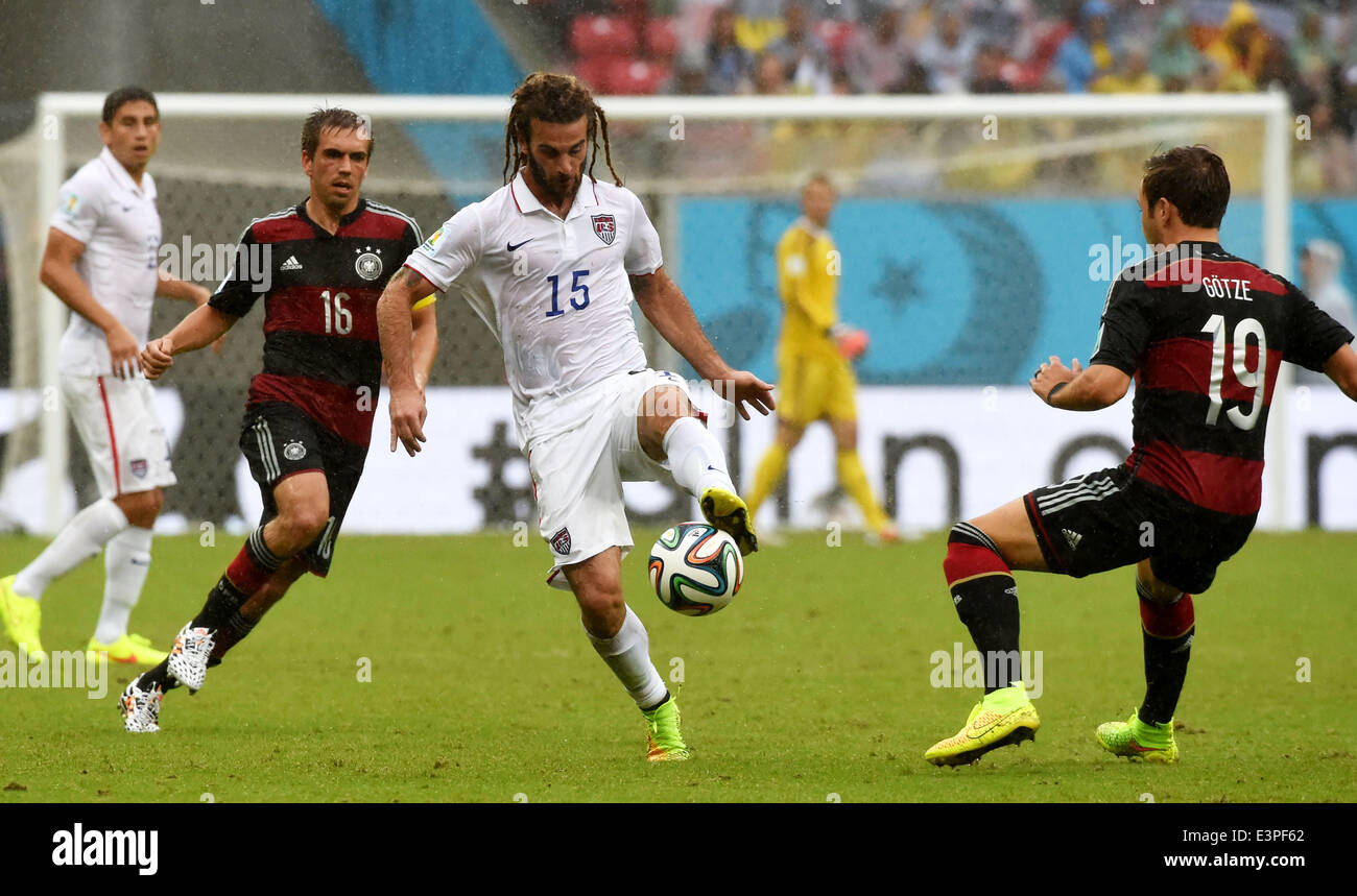 Recife, Brazil. 26th June, 2014. Kyle Beckerman (C, front) controls the ball during a Group G match between the U.S. and Germany of 2014 FIFA World Cup at the Arena Pernambuco Stadium in Recife, Brazil, on June 26, 2014. Germany won 1-0 over the U.S. on Thursday. Germany and the U.S. enter Round of 16 from Group G. Credit:  Guo Yong/Xinhua/Alamy Live News Stock Photo