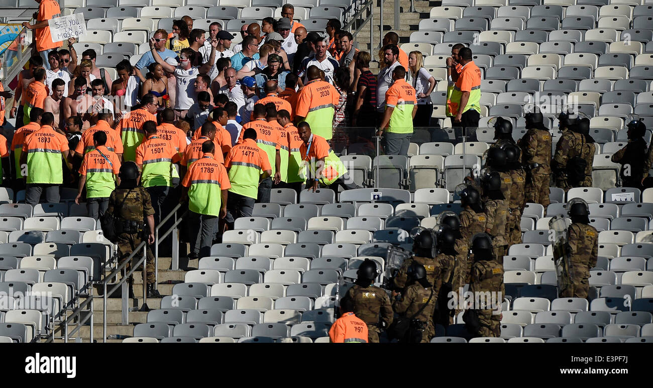 Belo Horizonte, Brazil. 24th June, 2014. Stadium stewards and riot police stand around England's frantic fans remaining in the stadium after a Group D match between Costa Rica and England of 2014 FIFA World Cup at the Estadio Mineirao Stadium in Belo Horizonte, Brazil, on June 24, 2014. England drew 0-0 with Costa Rica on Tuesday. © Qi Heng/Xinhua/Alamy Live News Stock Photo