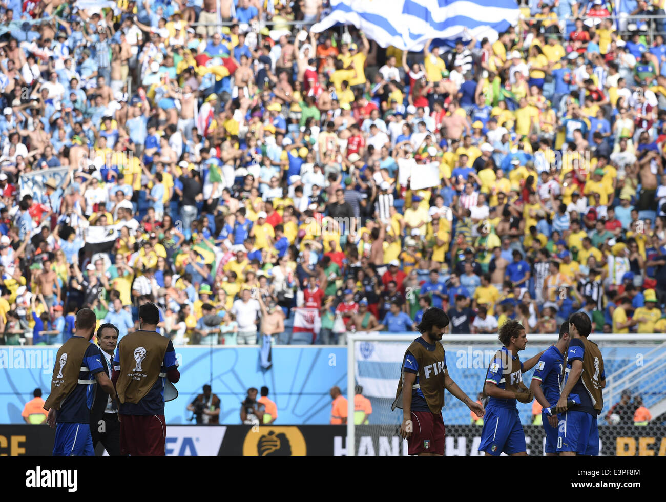 Natal, Brazil. 24th June, 2014. Italy's players leave the field after a Group D match between Italy and Uruguay of 2014 FIFA World Cup at the Estadio das Dunas Stadium in Natal, Brazil, June 24, 2014. Uruguay won 1-0 over Italy on Tuesday. © Lui Siu Wai/Xinhua/Alamy Live News Stock Photo