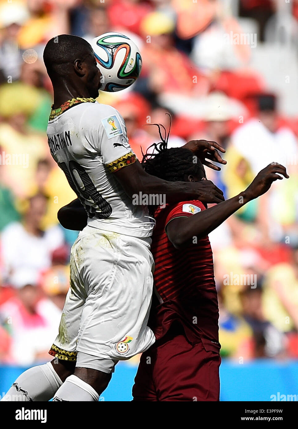 Brasilia, Brazil. 26th June, 2014. Ghana's Jonathan Mensah (L) competes for a header with Portugal's Eder during a Group G match between Portugal and Ghana of 2014 FIFA World Cup at the Estadio Nacional Stadium in Brasilia, Brazil, June 26, 2014. Portugal won 2-1 over Ghana on Thursday. © Qi Heng/Xinhua/Alamy Live News Stock Photo