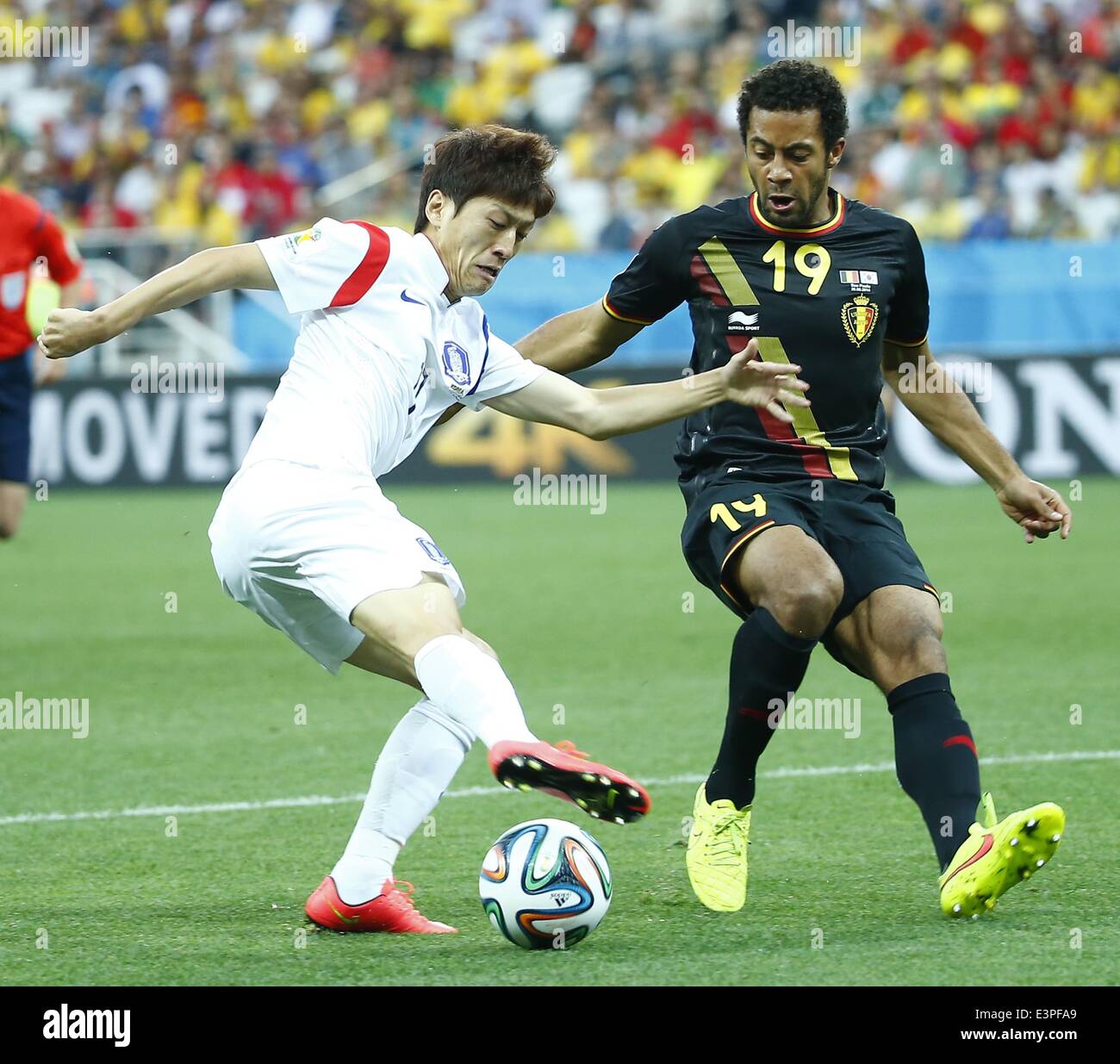 Sao Paulo, Brazil. 26th June, 2014. Belgium's Mousa Dembele (R) competes with South Korea's Lee Chung Yong during a Group H match between South Korea and Belgium of 2014 FIFA World Cup at the Arena de Sao Paulo Stadium in Sao Paulo, Brazil, on June 26, 2014. Credit:  Chen Jianli/Xinhua/Alamy Live News Stock Photo
