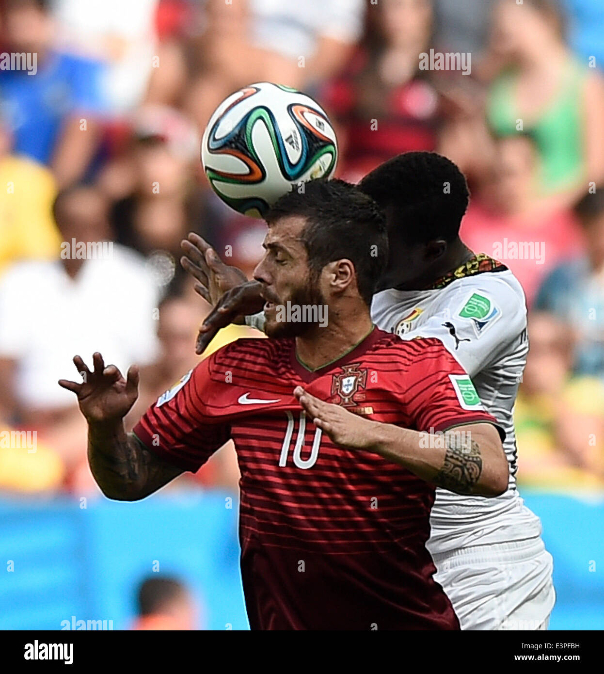 Brasilia, Brazil. 26th June, 2014. Portugal's Vieirinha (front) competes for a header during a Group G match between Portugal and Ghana of 2014 FIFA World Cup at the Estadio Nacional Stadium in Brasilia, Brazil, June 26, 2014. Portugal won 2-1 over Ghana on Thursday. © Qi Heng/Xinhua/Alamy Live News Stock Photo