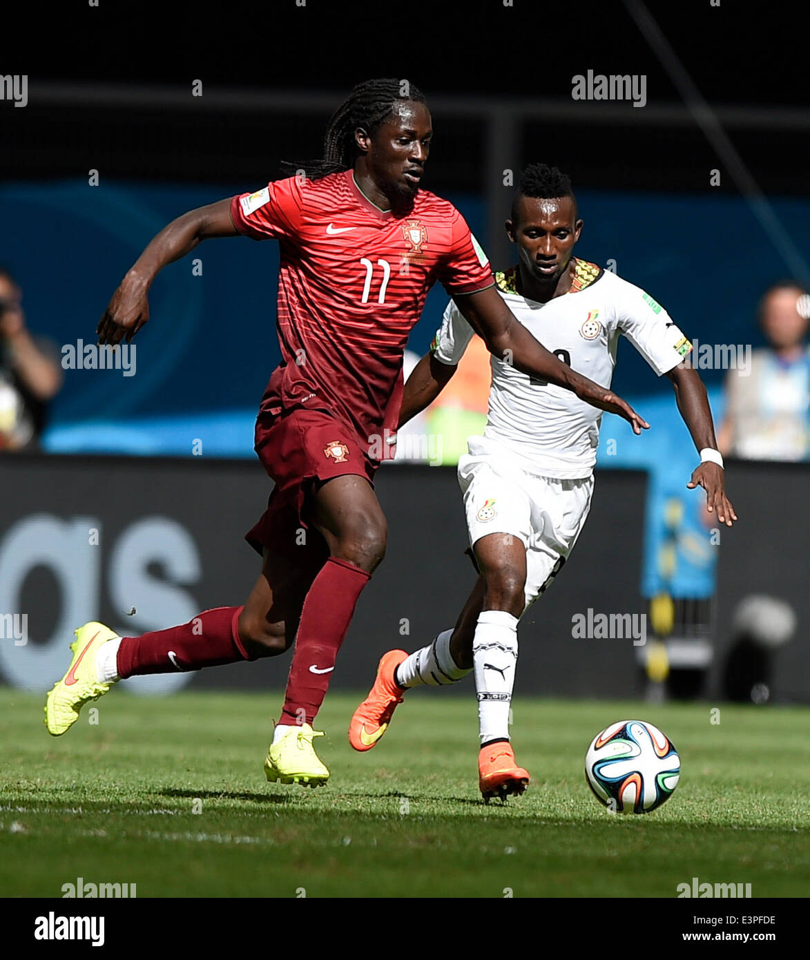 Brasilia, Brazil. 26th June, 2014. Portugal's Eder (L) vies with Ghana's Abdul Majeed Waris during a Group G match between Portugal and Ghana of 2014 FIFA World Cup at the Estadio Nacional Stadium in Brasilia, Brazil, June 26, 2014. Portugal won 2-1 over Ghana on Thursday. © Qi Heng/Xinhua/Alamy Live News Stock Photo