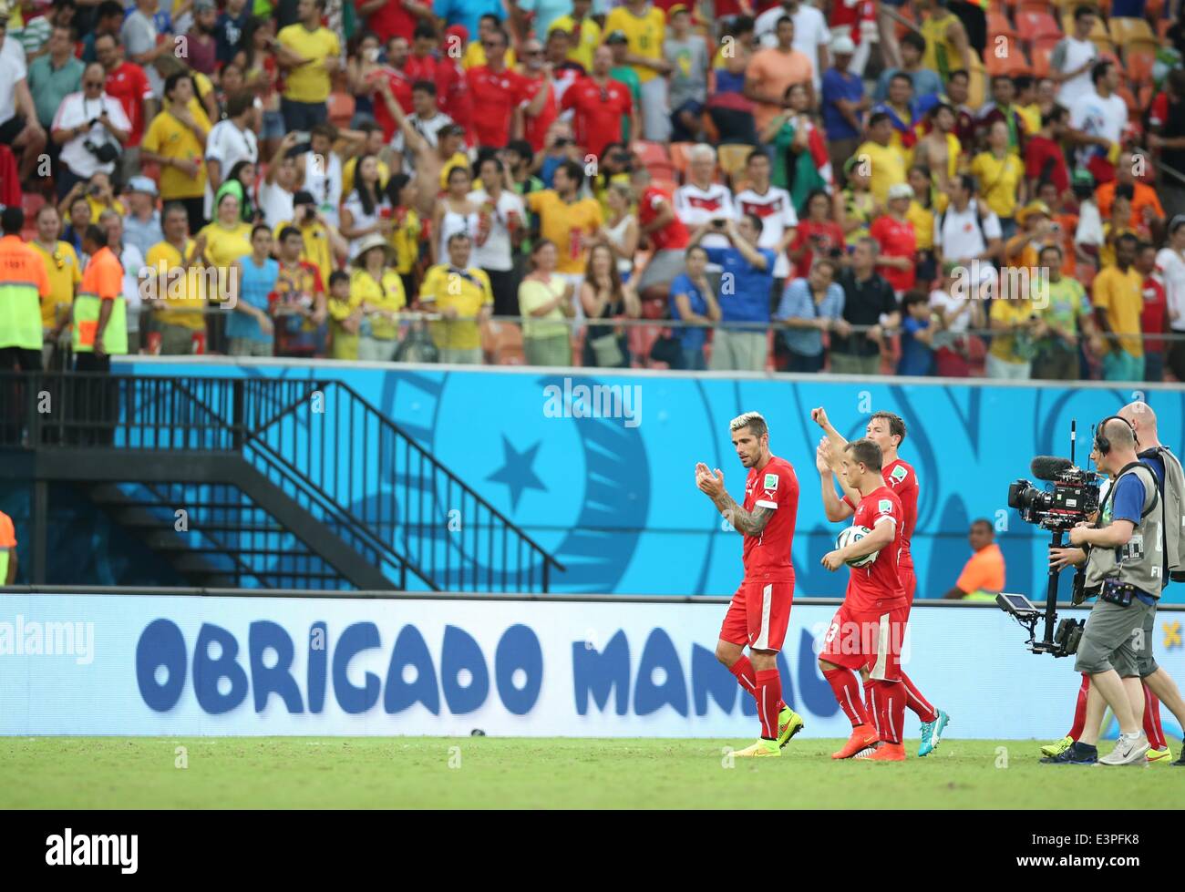 (140625) -- MANAUS, June 25, 2014 (Xinhua) -- Switzerland's players leave the field after a Group E match between Honduras and Switzerland of 2014 FIFA World Cup at the Arena Amazonia Stadium in Manaus, Brazil, on June 25, 2014. Switzerland won 3-0 over Honduras on Wednesday. (Xinhua/Li Ming)(pcy) Stock Photo