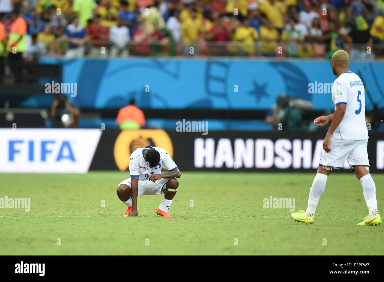 (140625) -- MANAUS, June 25, 2014 (Xinhua) -- Honduras' Marvin Chavez (L) reacts after a Group E match between Honduras and Switzerland of 2014 FIFA World Cup at the Arena Amazonia Stadium in Manaus, Brazil, on June 25, 2014.(Xinhua/Liu Dawei)(pcy) Stock Photo