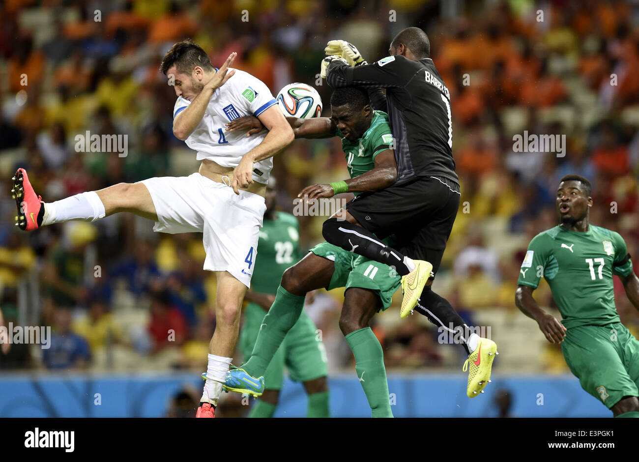(140624) -- FORTALEZA, June 24, 2014 (Xinhua) -- Cote d'Ivoire's goalkeeper Boubacar Barry (1st R, top) blocks the ball during a Group C match between Greece and Cote d'Ivoire of 2014 FIFA World Cup at the Estadio Castelao Stadium in Fortaleza, Brazil, June 24, 2014. (Xinhua/Yang Lei)(xzj) Stock Photo