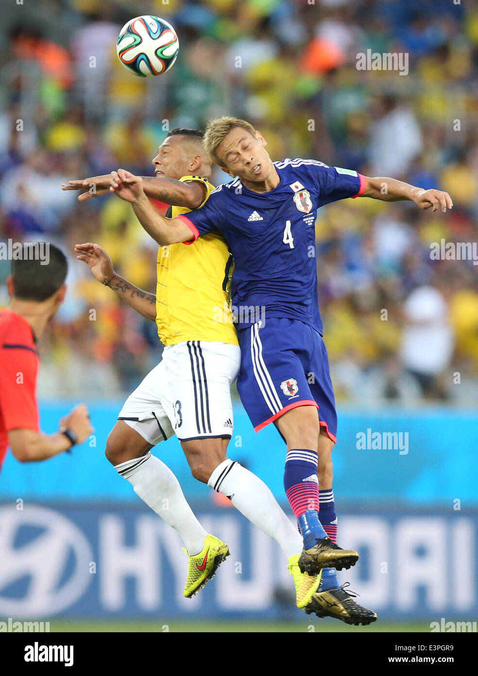 (140624) -- CUIABA, June 24, 2014 (Xinhua) -- Japan's Keisuke Honda jumps for a header during a Group C match between Japan and Colombia of 2014 FIFA World Cup at the Arena Pantanal Stadium in Cuiaba, Brazil, June 24, 2014. (Xinhua/Li Ming) Stock Photo