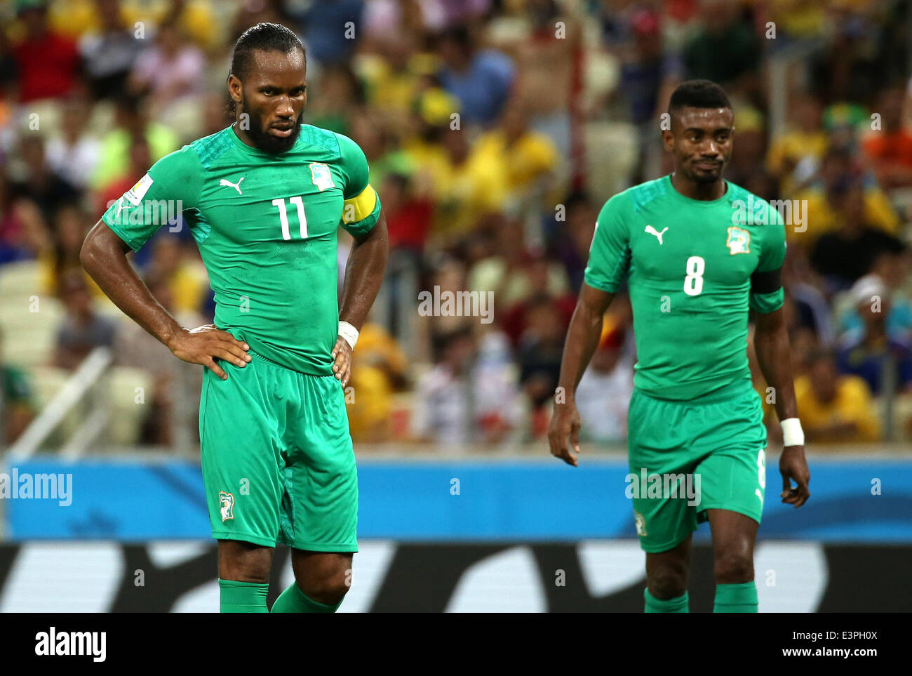 (140624) -- FORTALEZA, June 24, 2014 (Xinhua) -- Cote d'Ivoire's Didier Drogba (L) and Salomon Kalou react during a Group C match between Greece and Cote d'Ivoire of 2014 FIFA World Cup at the Estadio Castelao Stadium in Fortaleza, Brazil, June 24, 2014. Greece won 2-1 over Cote d'Ivoire on Tuesday. (Xinhua/Cao Can)(xzj) Stock Photo
