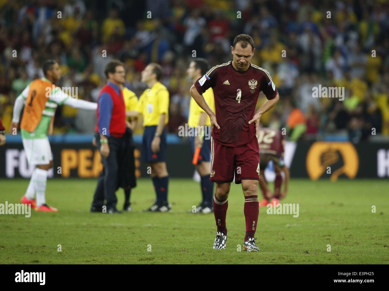 (140626) -- CURITIBA, June 26, 2014 (Xinhua) -- Russia's Sergey Ignashevich reacts after a Group H match between Algeria and Russia of 2014 FIFA World Cup at the Arena da Baixada Stadium in Curitiba, Brazil, June 26, 2014. The match ended in a 1-1 draw.Algeria enters Round of 16 after the Thursday match which ended in a 1-1 draw.(Xinhua/Liao Yujie) Stock Photo