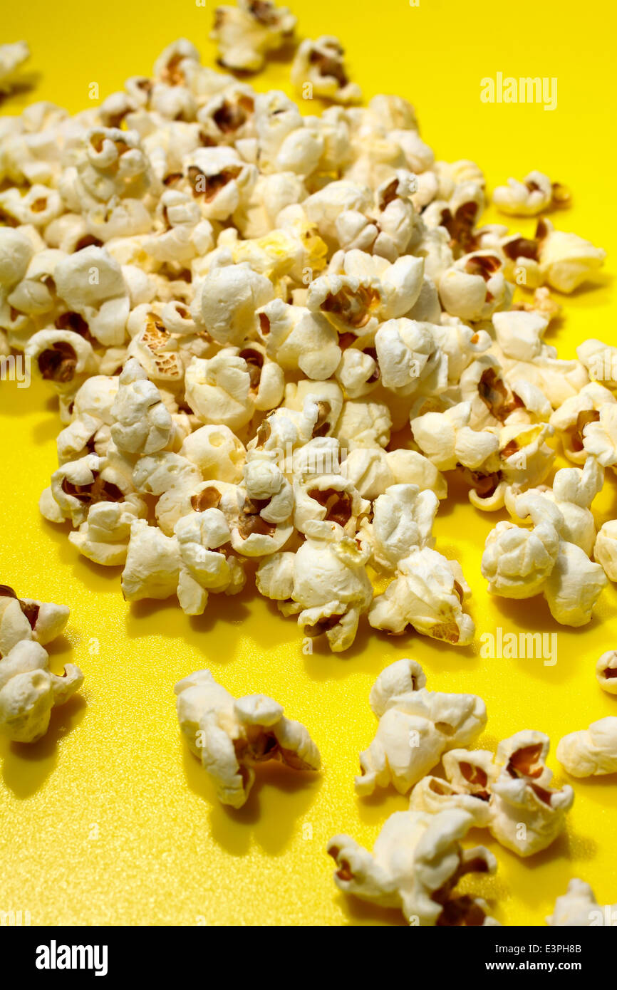 Popcorn on a yellow background Stock Photo