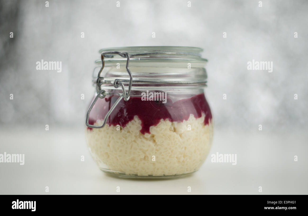 Rice pudding with cherry sauce in a bottling jar, 13 June 2014 in Hamburg. Stock Photo