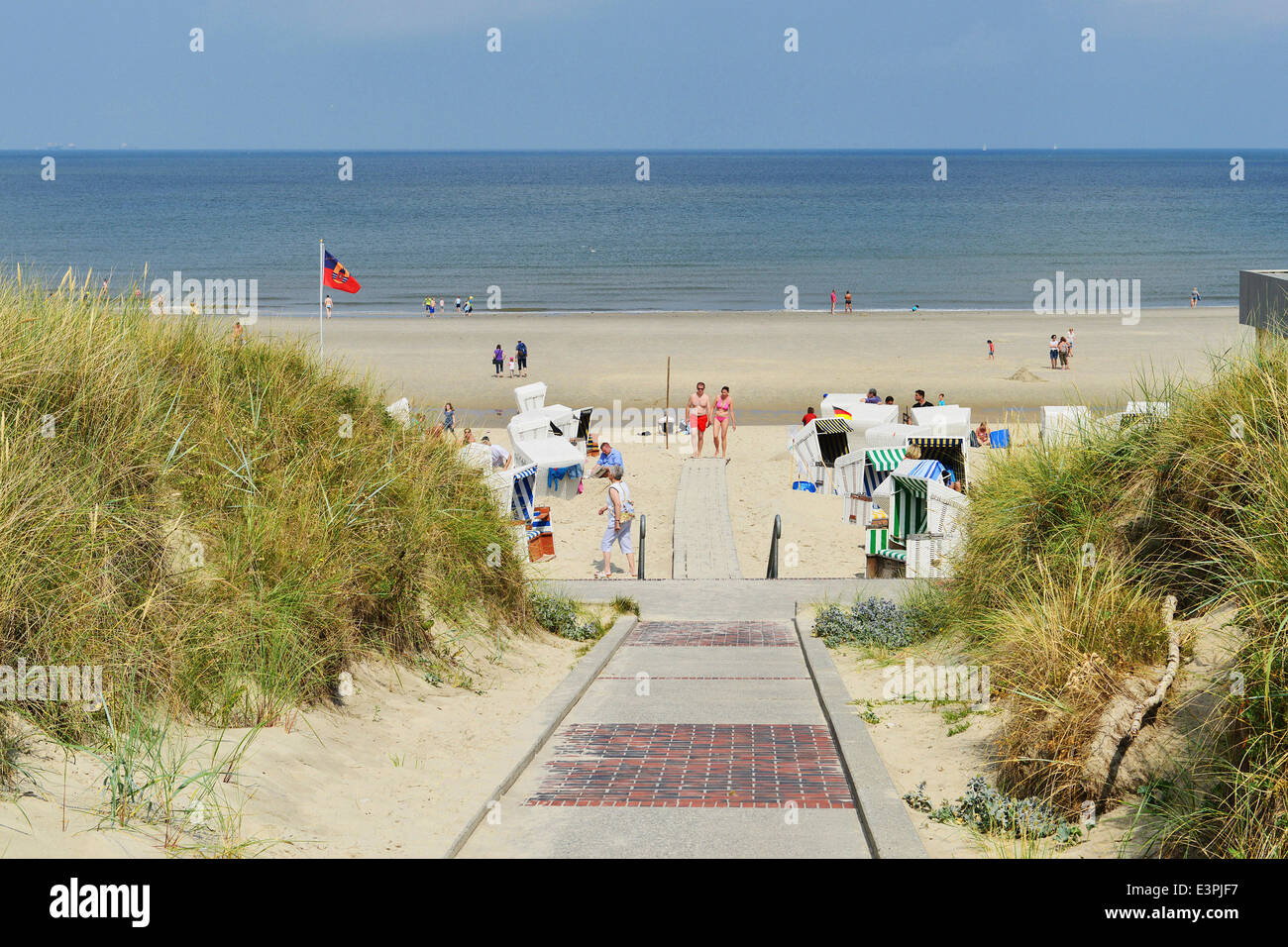 Dune way to the beach, North Sea and beach chairs behind it; 17 August ...