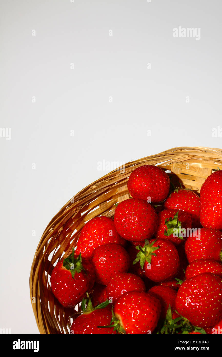 Strawberries in a basket with room for copy Stock Photo - Alamy