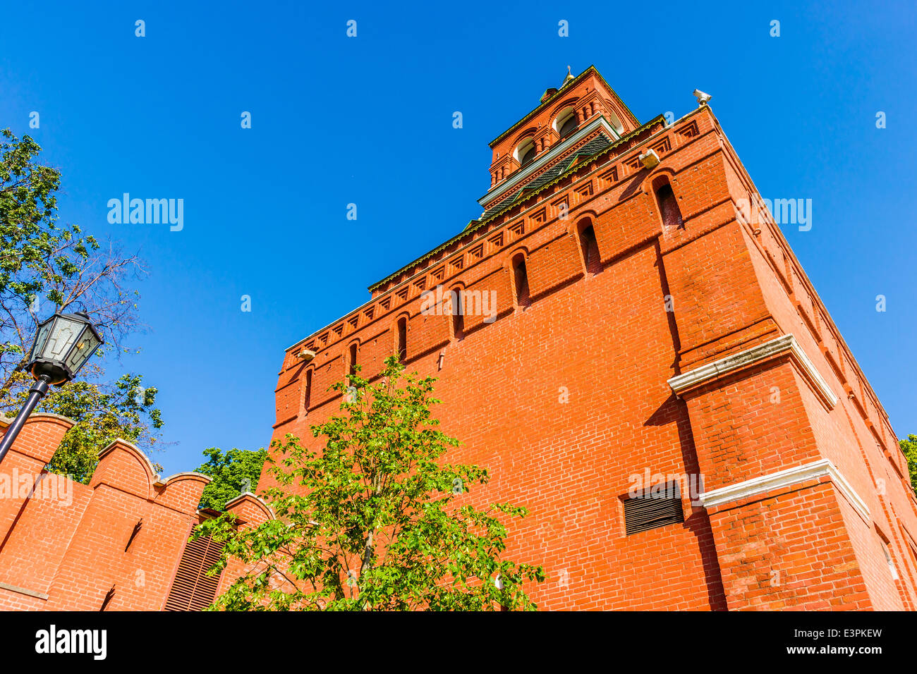 Closeup view and details of Konstantino-Eleninskaya tower of Moscow Kremlin against clear blue sky Stock Photo