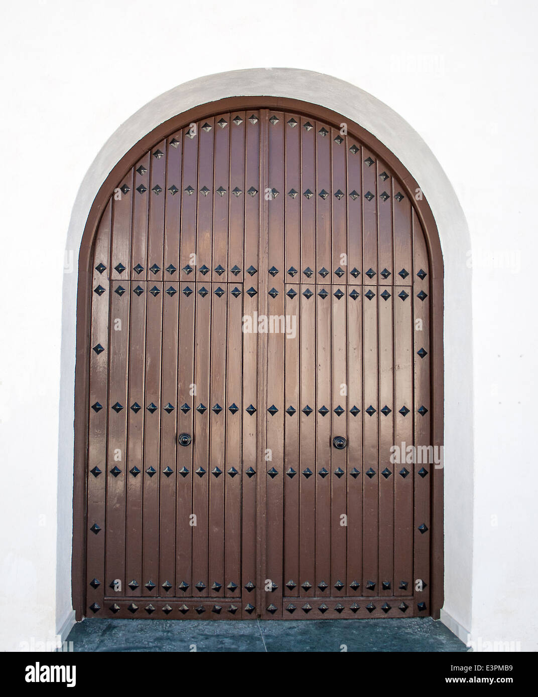 close up of Old brown wooden Spanish front door Stock Photo