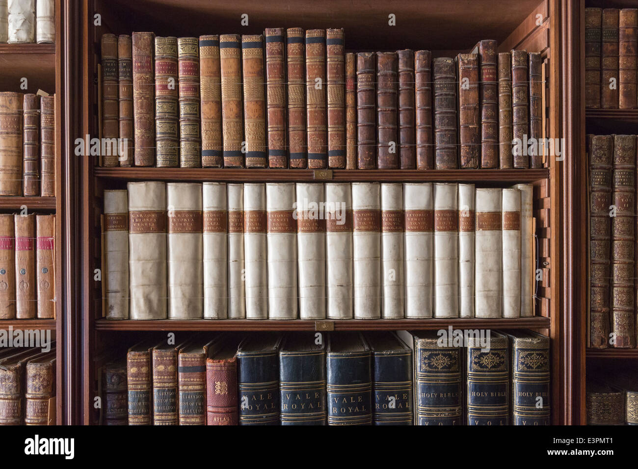 Antique Books Lined Up And Neatly Displayed On Bookshelves In Library Stock Photo Alamy