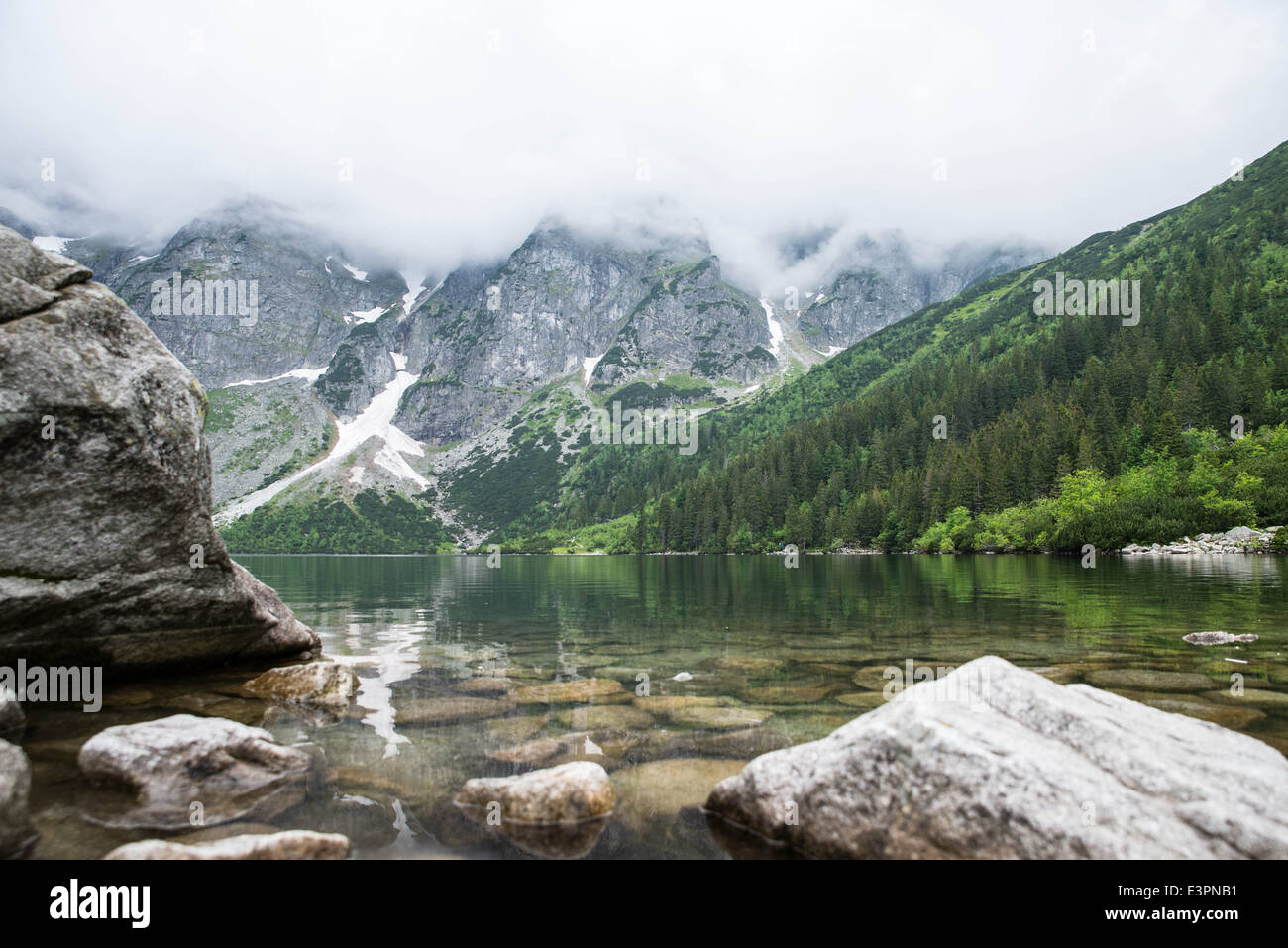 Lake, mountains and rocks Stock Photo - Alamy