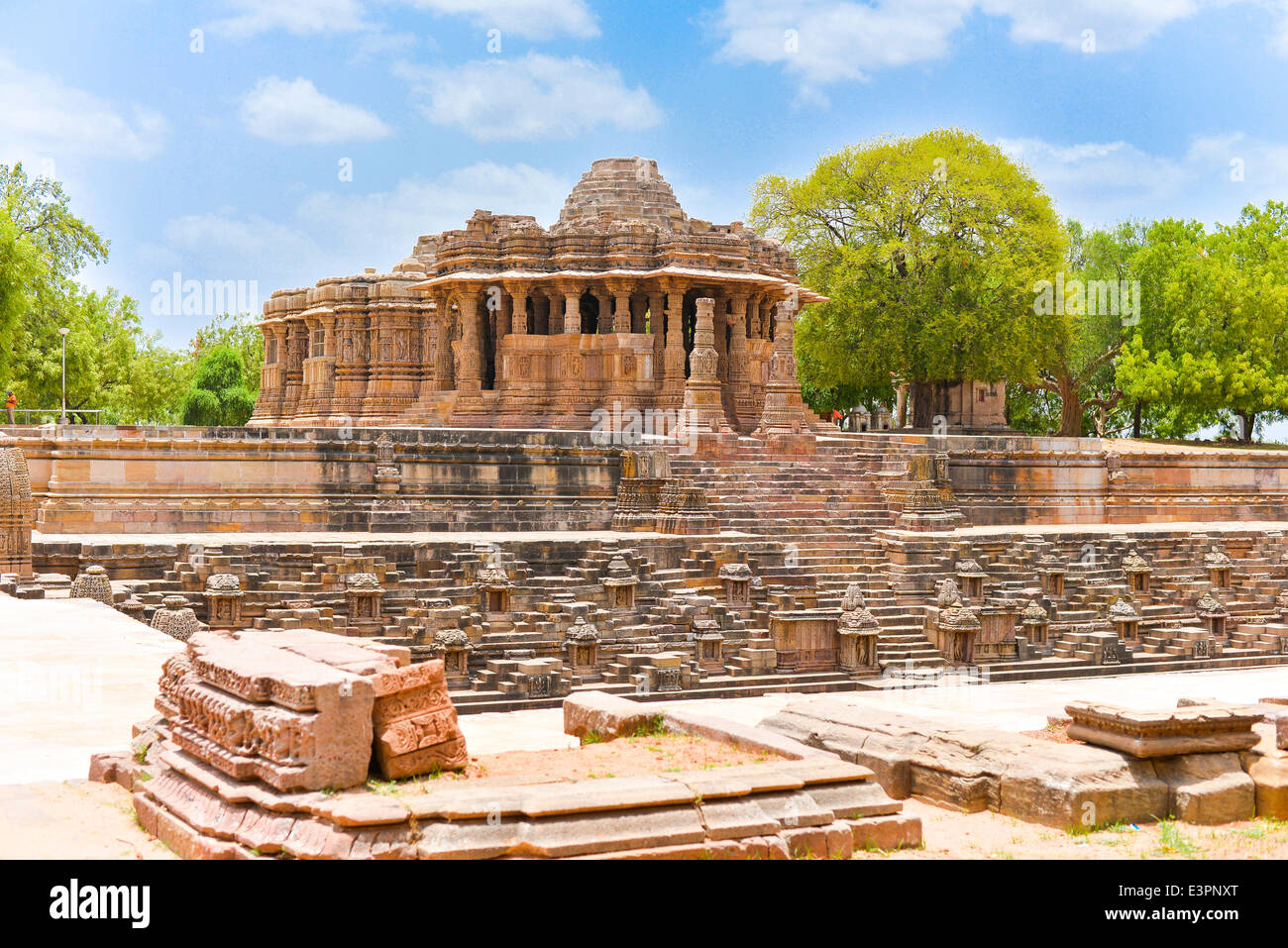 Constructed in 1026-27 A.D. during the reign of King Bhimdev I of Patan, the temple is dedicated to Surya or the Sun God. Although it bears a dilapidated look, it is still a magnificent specimen of superb artistry of Gujarat's architects of the bygone days. Modhera's sun temple is positioned in such a manner that at the equinoxes the rising sun strikes the images in the sanctuary.  It also incorporates an amusement park, a museum, a cafeteria, picture gallery and library.  The canvas on the walls and pillars depict the incidents from the Ramayan and the Mahabharat, and forms of gods and goddes Stock Photo