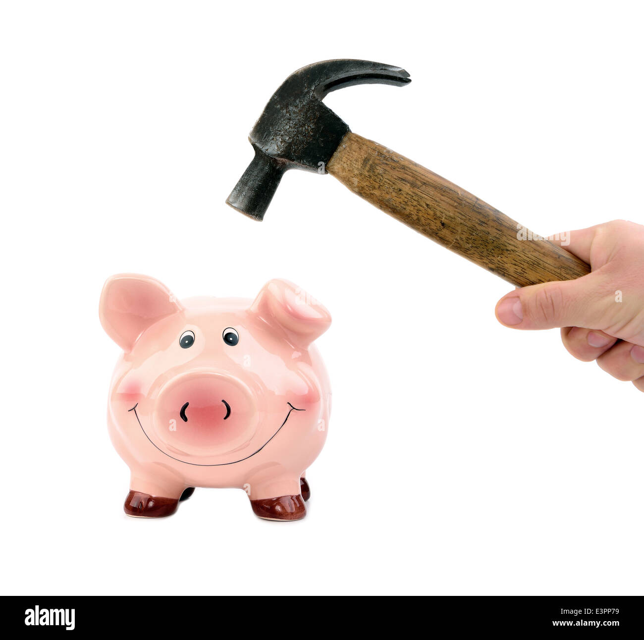 A hand holding a hammer which is raised above a piggy bank Stock Photo ...