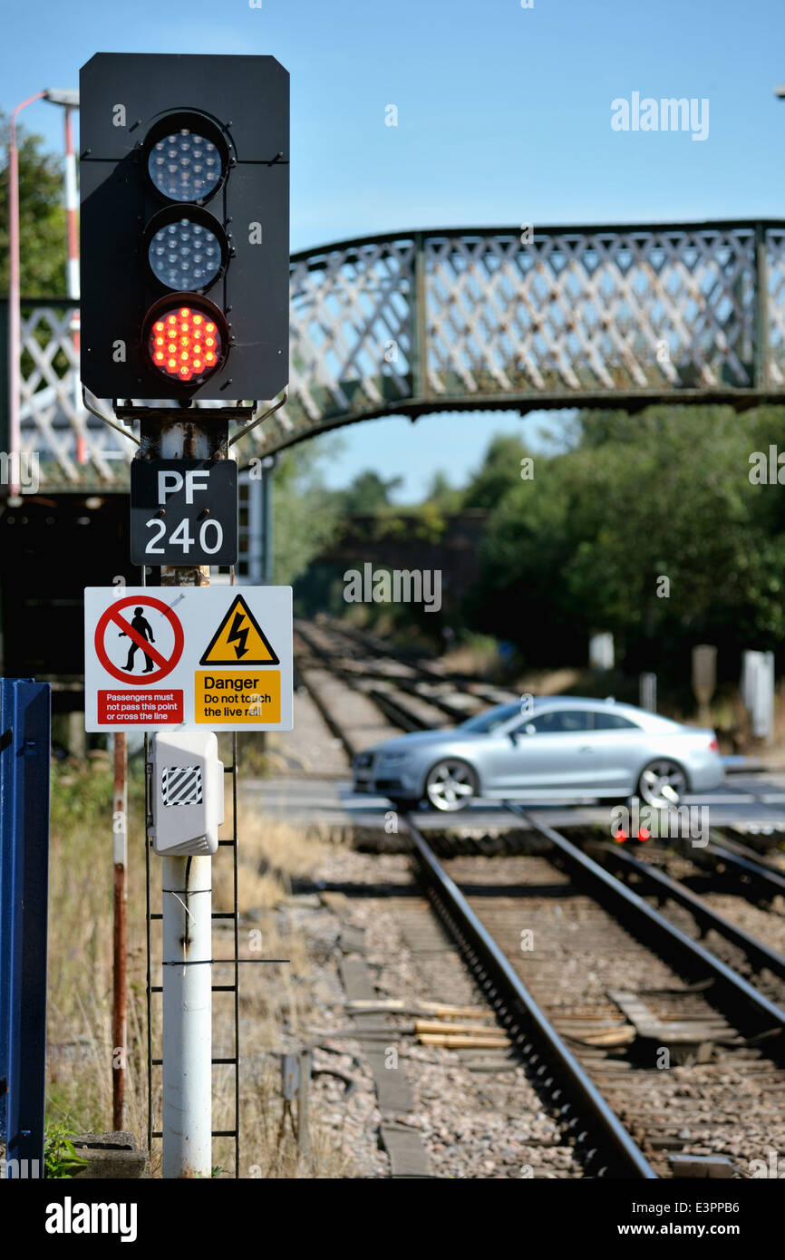 Car on level crossing at Petersfield station, Hampshire on the London Waterloo to Portsmouth Harbour line Stock Photo