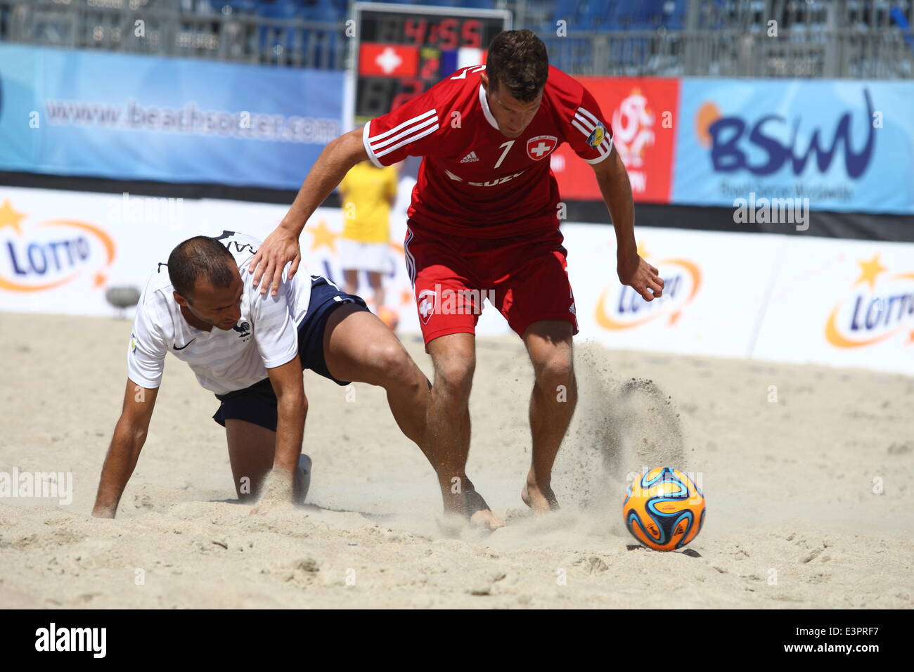 Sopot, Poland. 27th June, 2014. Euro Beach Soccer League tournament in Sopot. Game between France and Switzerland. Sandro Spaccarotella (7) in action against Didier Samoun (5) during the game. Credit:  Michal Fludra/Alamy Live News Stock Photo