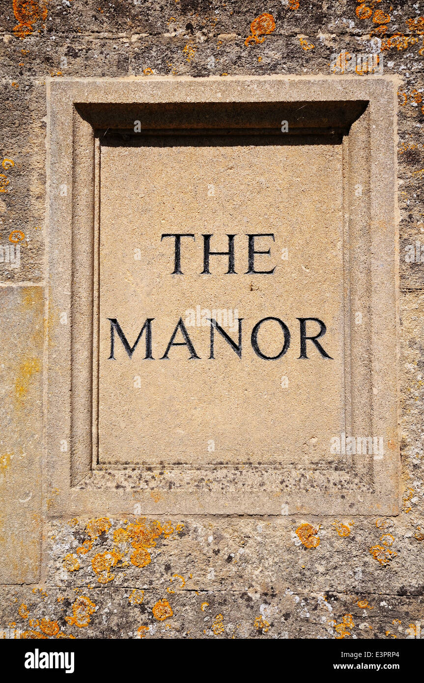 The Manor sign carved in Cotswold stone, Bourton on the Water, Gloucestershire, England, UK, Western Europe. Stock Photo