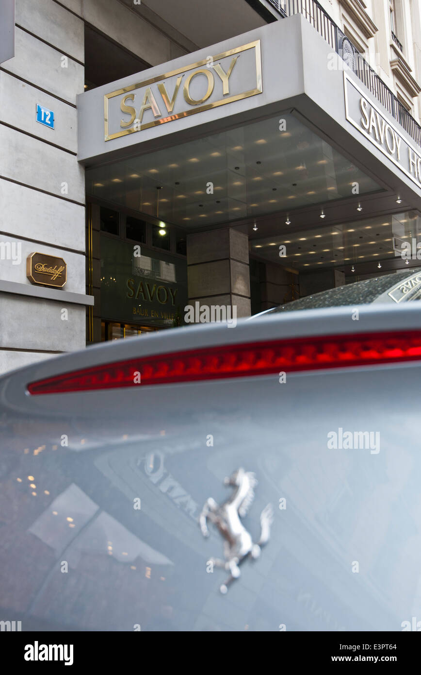 A Ferrari parked outside the Savoy luxury Hotel on Zurich's Bahnhofstrasse. Stock Photo