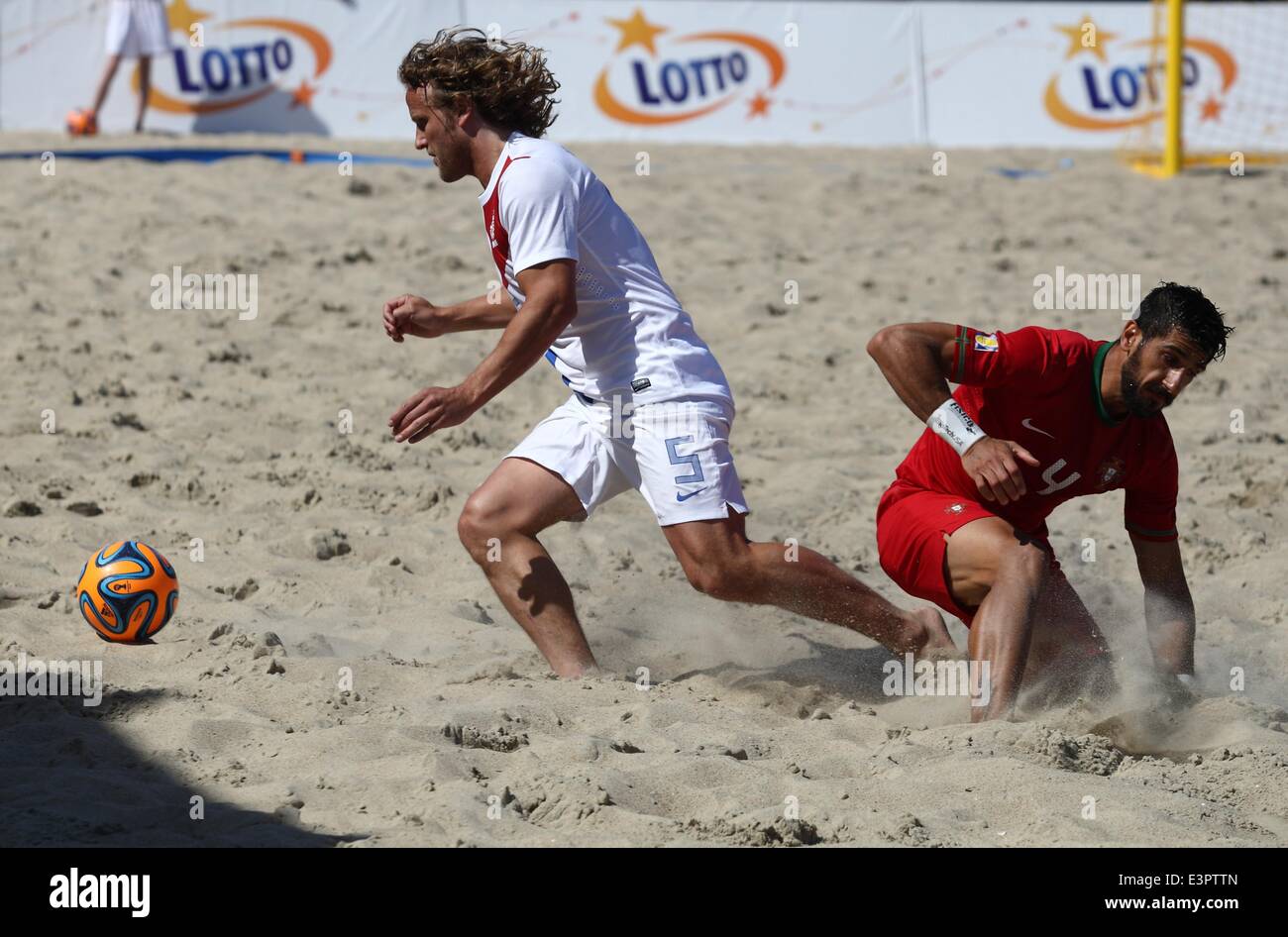 Sopot, Poland. 27th June, 2014. Euro Beach Soccer League tournament in Sopot.  Game between Portugal and Netherlands. Bruno Torres (4) in action against  Rene van Dieren during the game. Credit: Michal Fludra/Alamy