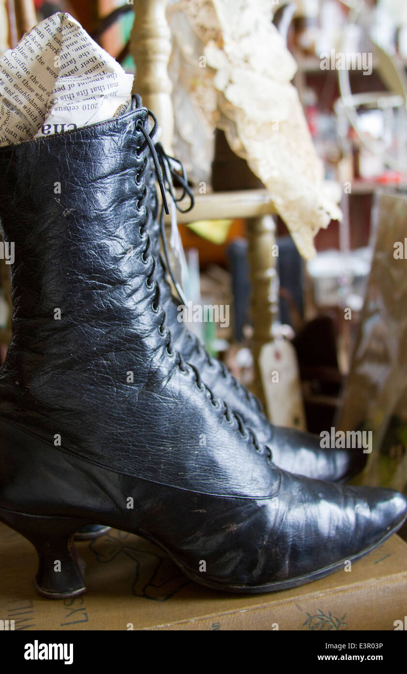 Womans leather lace up shoe Antiques and old items in store in Leadville Colorado Stock Photo