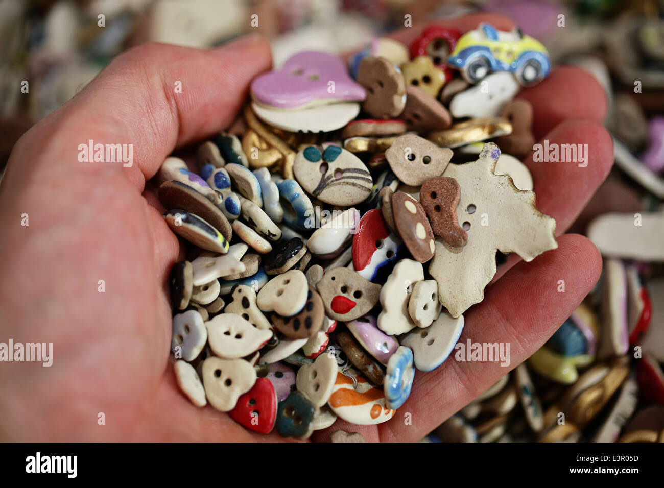 A handful of handmade clay buttons Stock Photo
