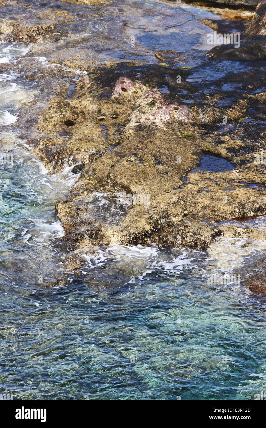 Rocky beach clear blue water hi-res stock photography and images - Alamy