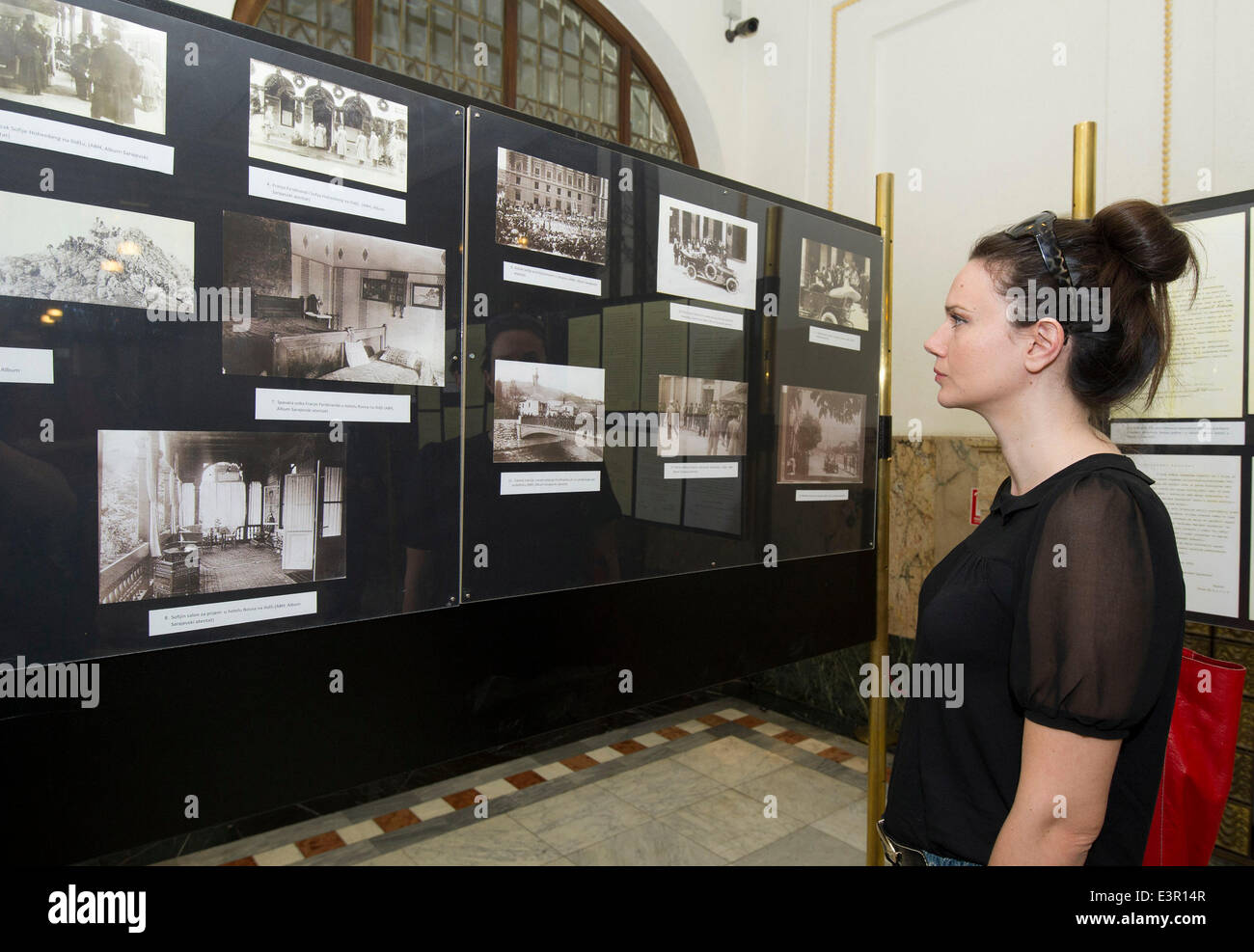 Zagreb, Croatia. 27th June, 2014. A visitor looks at the photos exhibited during the official commemoration of the 100th anniversary of the start of World War I (WWI) at the Croatian State Archives in Zagreb, Croatia, June 27, 2014. The central ceremony of marking the start of the WWI was held here on Friday. © Miso Lisanin/Xinhua/Alamy Live News Stock Photo