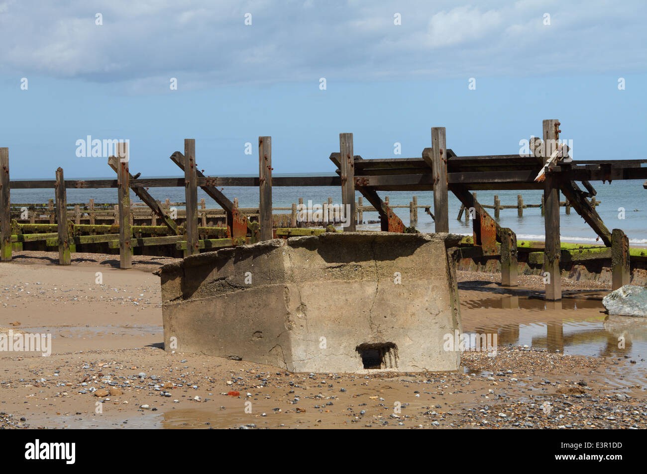 Broken sea defences and old wartime bunker at Happisburgh, Norfolk ...