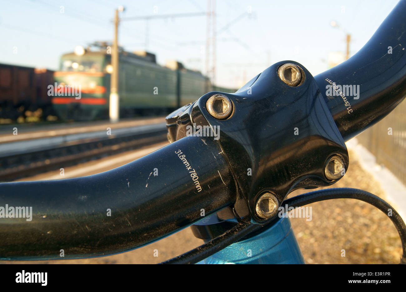 Bicycle handlebar and a train Stock Photo