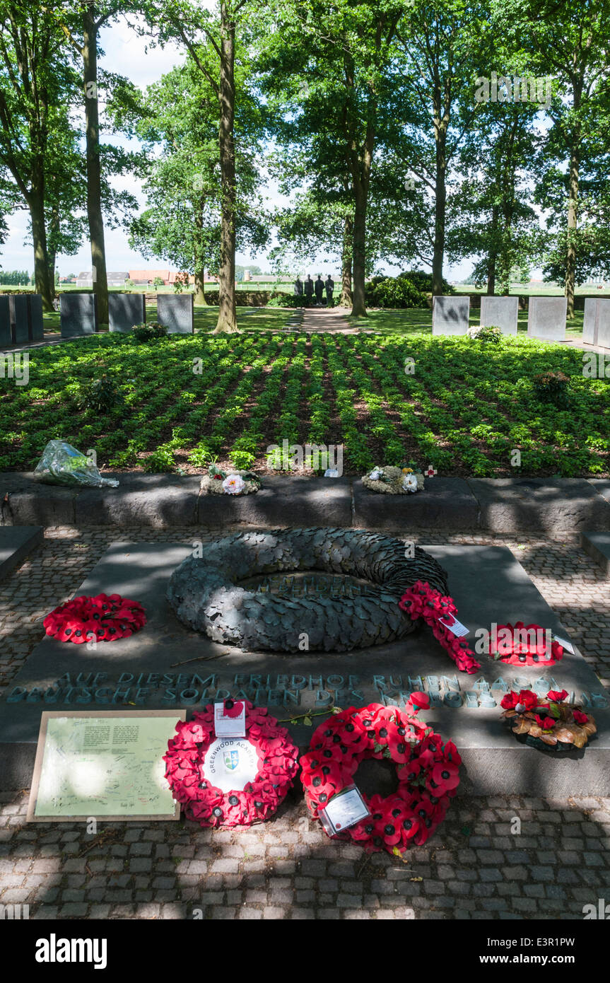 Poppy wreaths laid in front of the Kameraden Grab or Comrades Grave inside Langemark German War cemetery Stock Photo