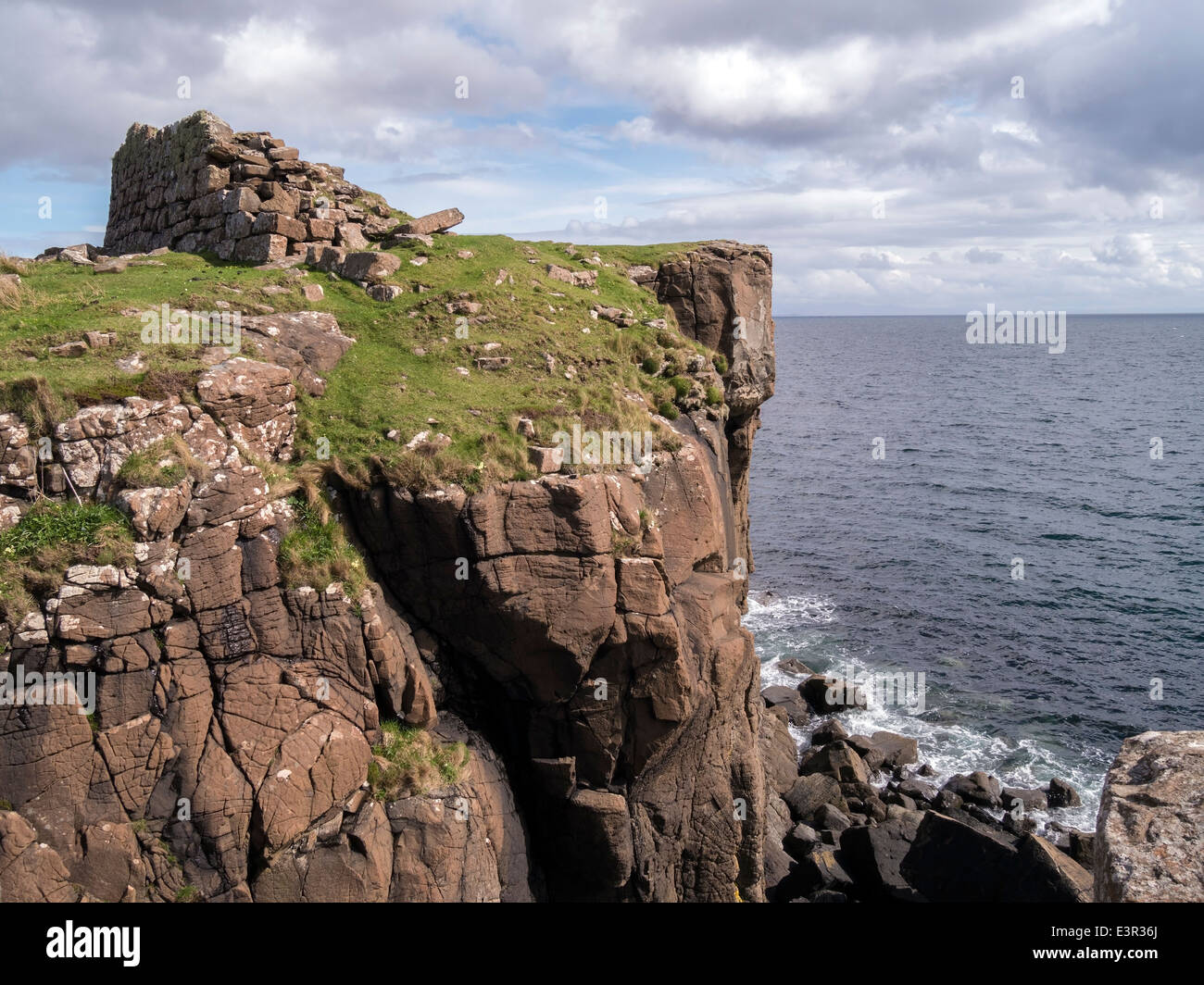 Ruins of ancient Scottish coastal promontory fort ( Dun ) at Rubha an Dunain headland, Glenbrittle, Isle of Skye, Scotland, UK Stock Photo