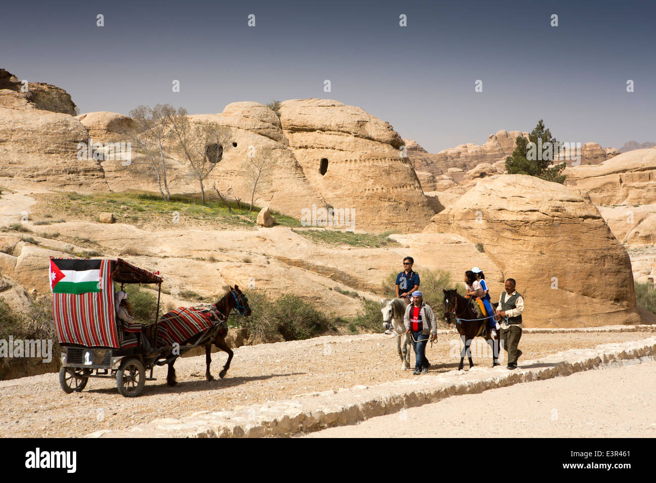 Jordan, Arabah, Petra, carriage and horses giving tourists ride to Al-Siq entrance Stock Photo