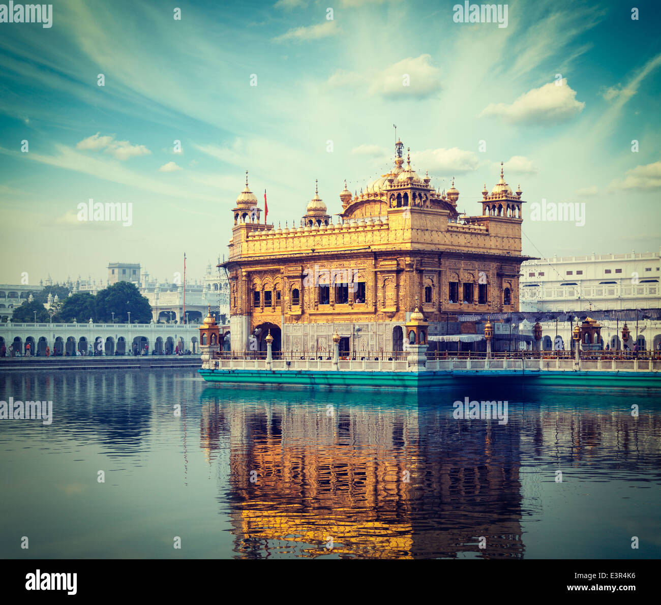 Vintage retro hipster style travel image of famous India attraction Sikh gurdwara Golden Temple (Harmandir Sahib). Amritsar Stock Photo