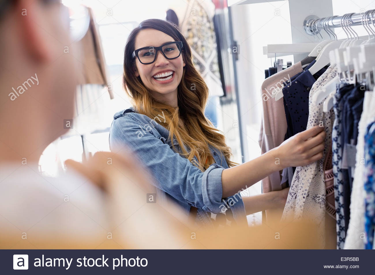 Couple shopping in clothing store Stock Photo