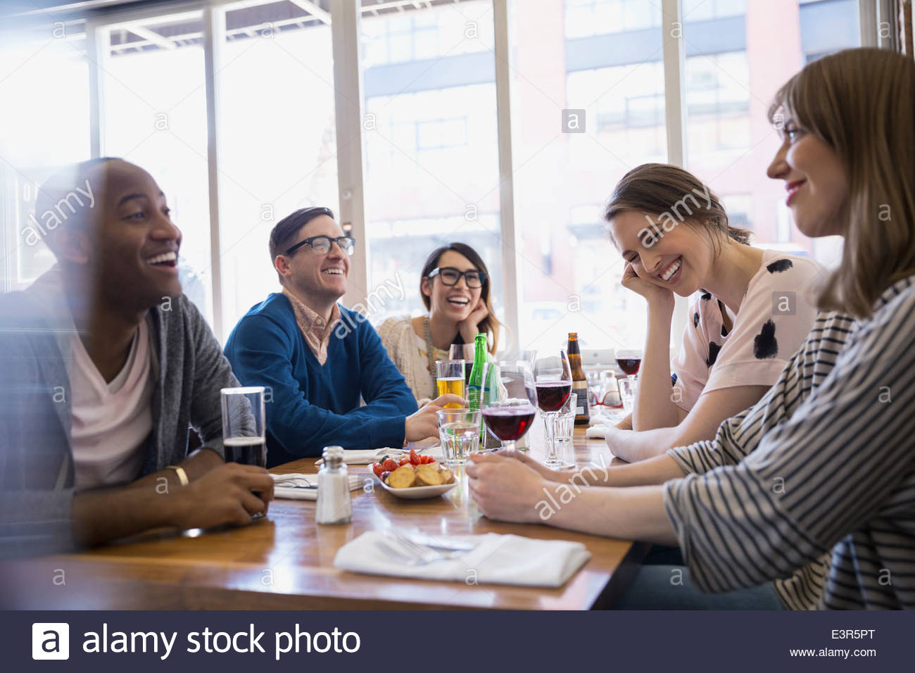 Friends drinking beer and wine at bistro table Stock Photo Alamy