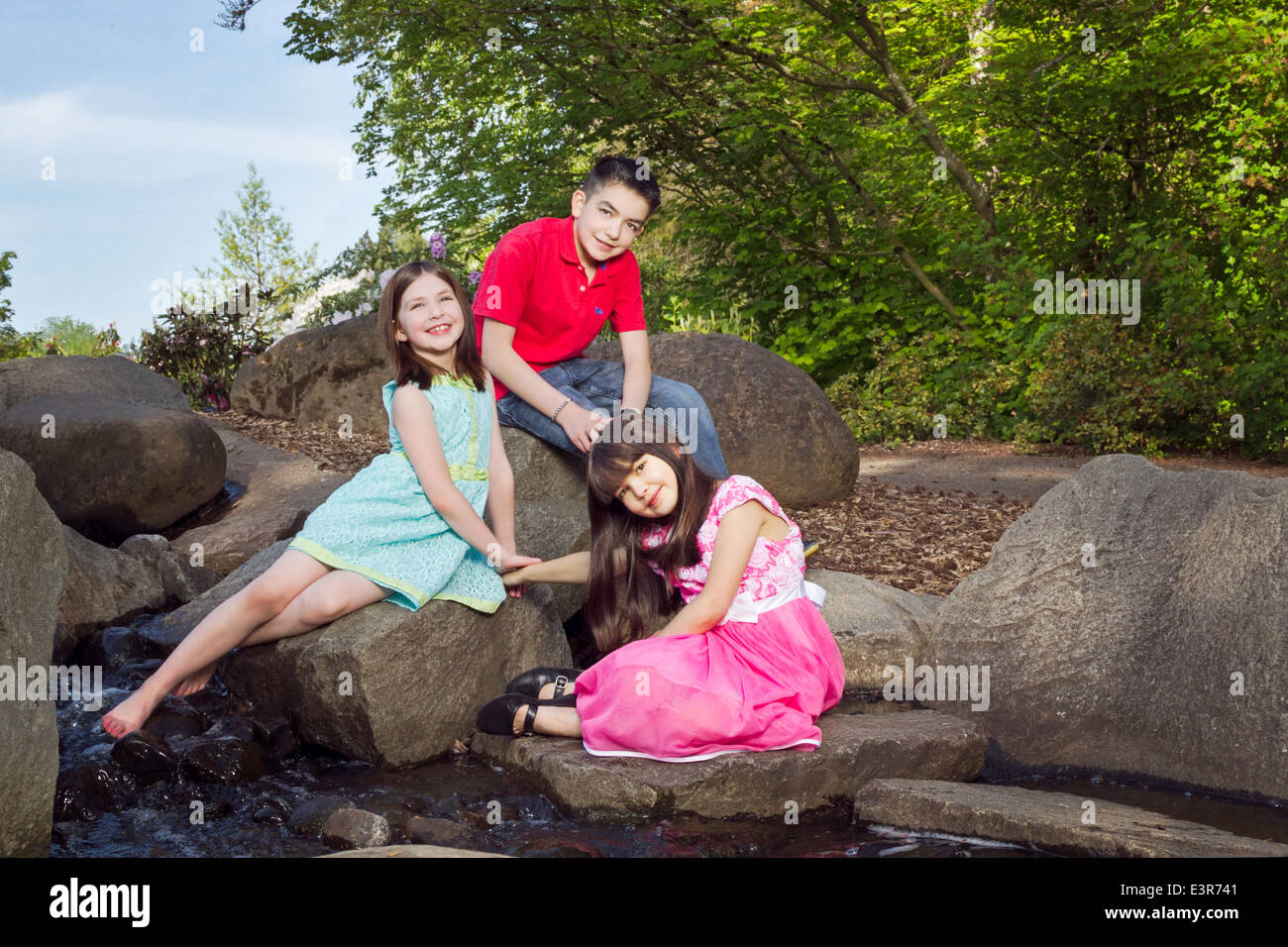Portrait of siblings enjoying springtime at the park Stock Photo