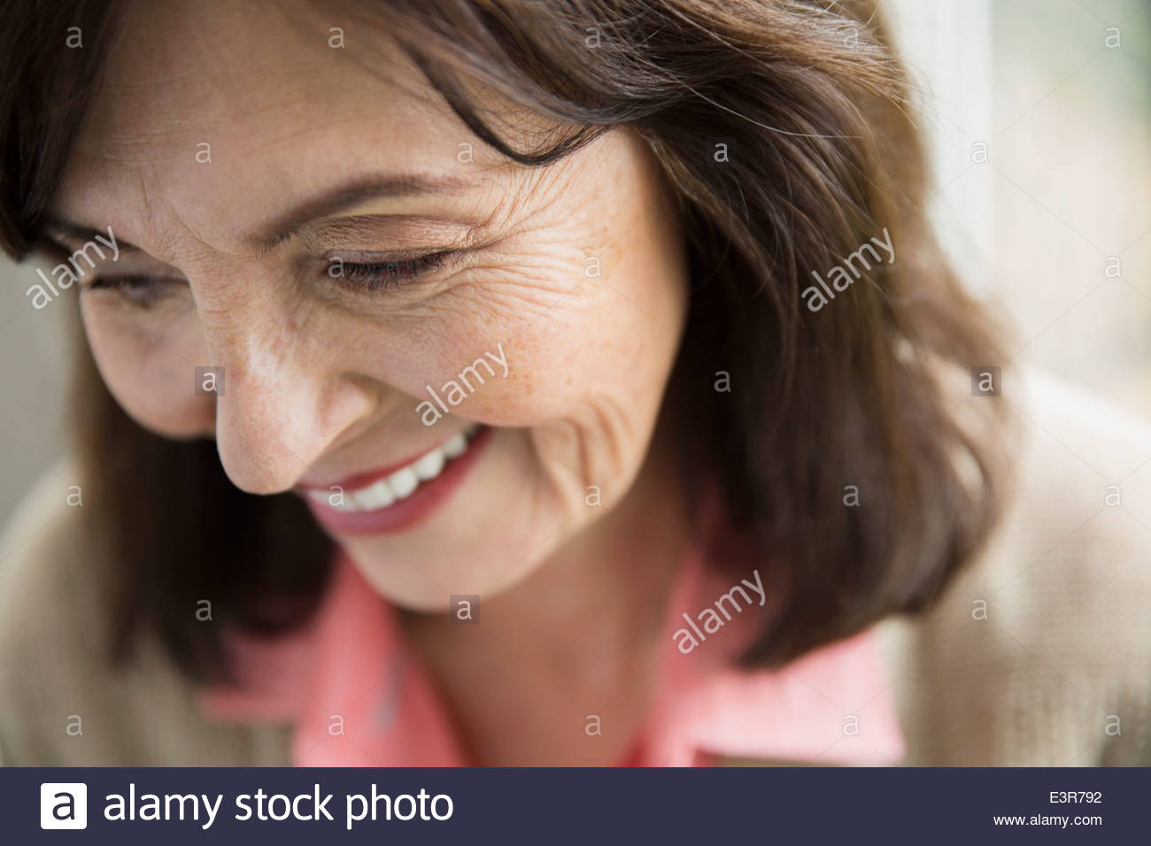 Close up of smiling woman looking down Stock Photo