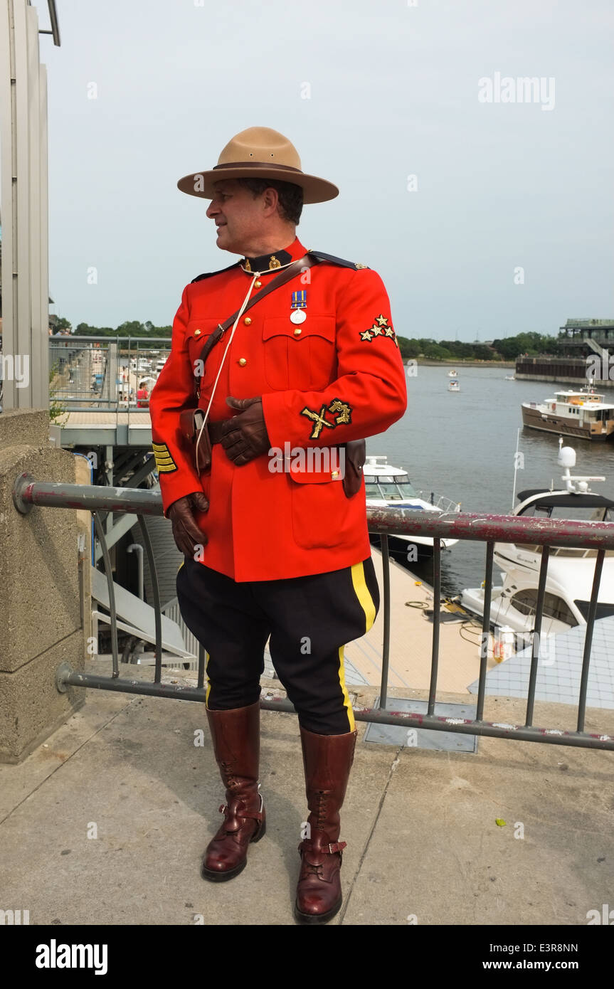 An RCMP officer in uniform during Canada Day celebrations in the Old Port of Montreal, Quebec Stock Photo