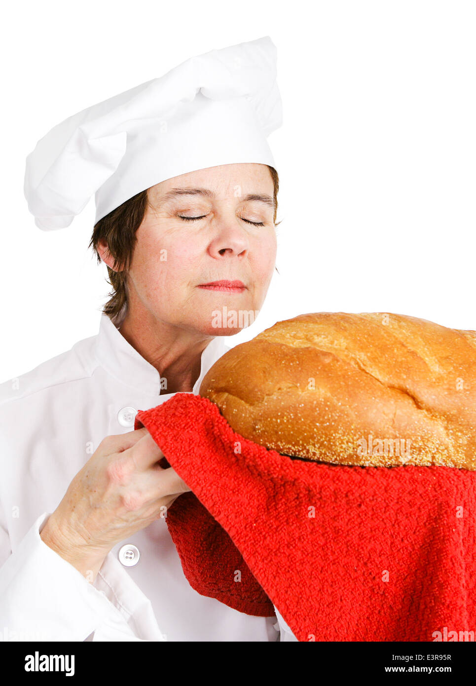 Chef baker smelling fresh baked bread. Isolated on white.  Stock Photo