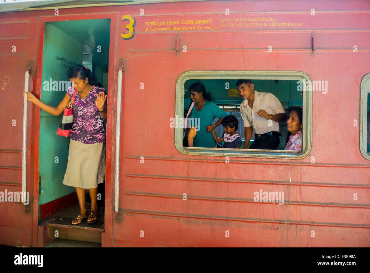 Sri Lankan woman geting off the train Kandy Sri Lanka Stock Photo