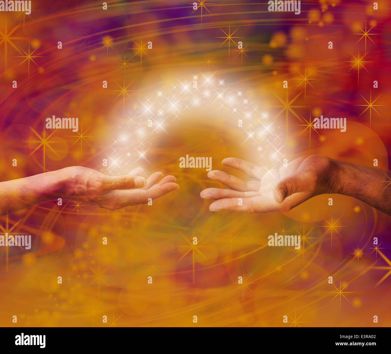 Man and woman both with one hand each palm up with an arc of white light and sparkles joining them on an amber background Stock Photo