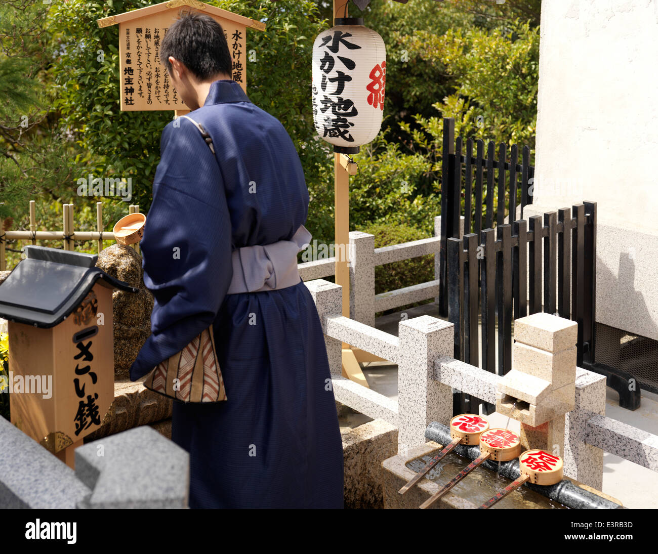 Young Japanese man in kimono following a ritual at Jishu-Jinja matchmaking  shrine, shrine to the god of love and marriage, Kyoto Stock Photo - Alamy