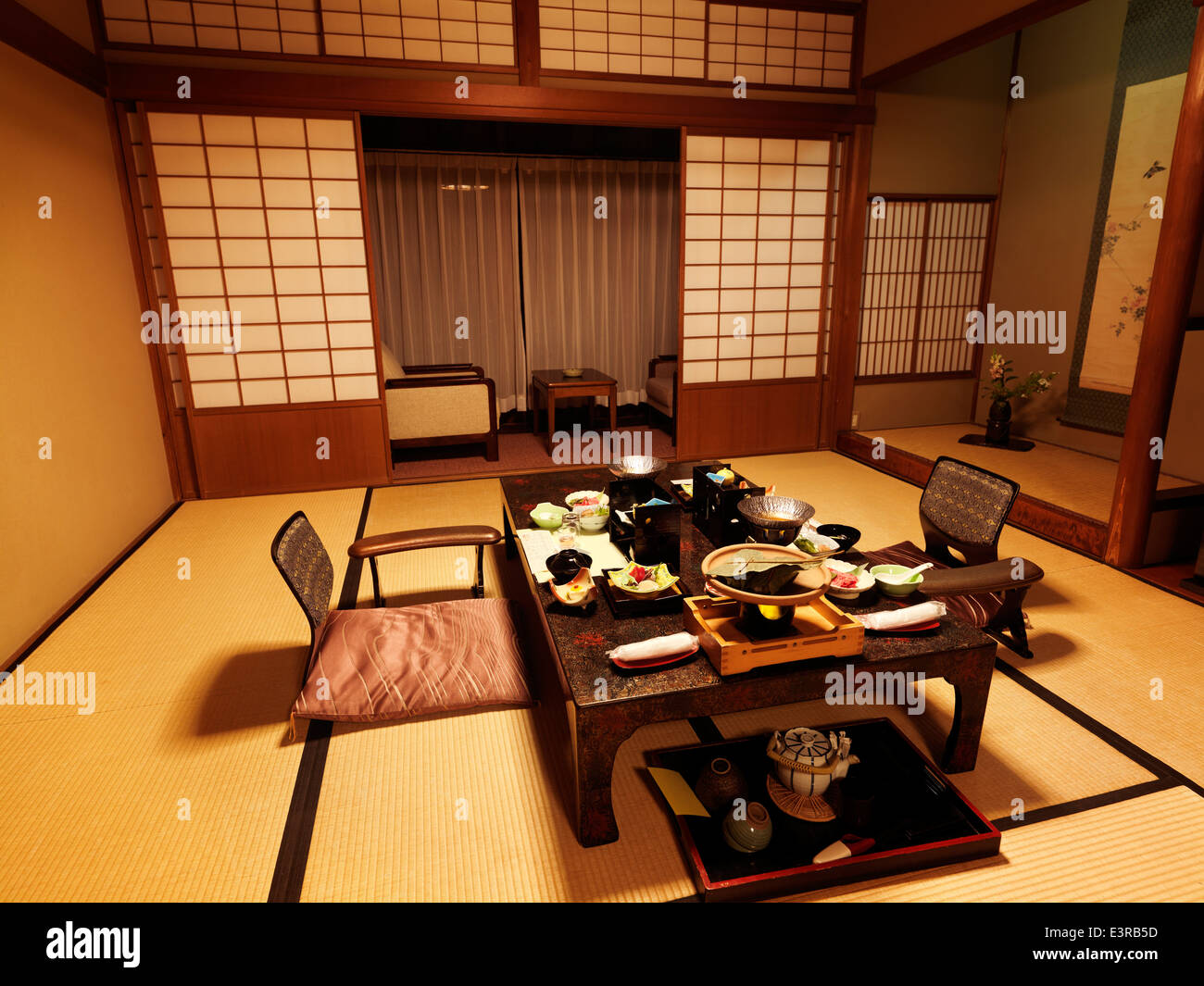 Japanese traditional ryokan hotel room with dinner on a table. Gero