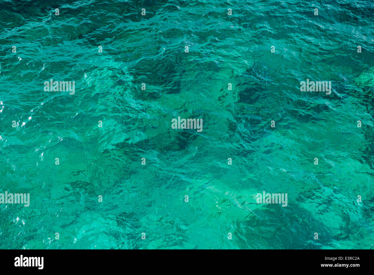Clear green wavy sea water texture background Stock Photo