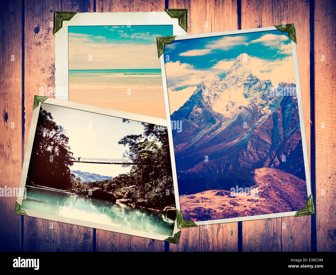 Vintage style adventure travel photos in old photo corners and edges on a wooden background Stock Photo